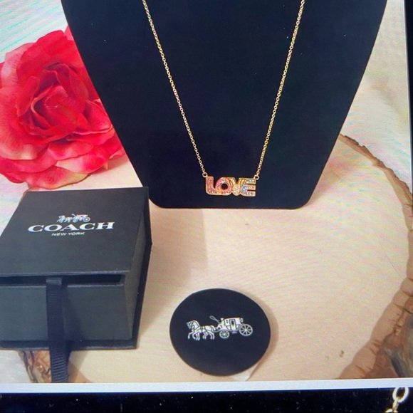 Coach Jewelry - COACH LOVE NWOT gold toned necklace w rhinestones 20” $40